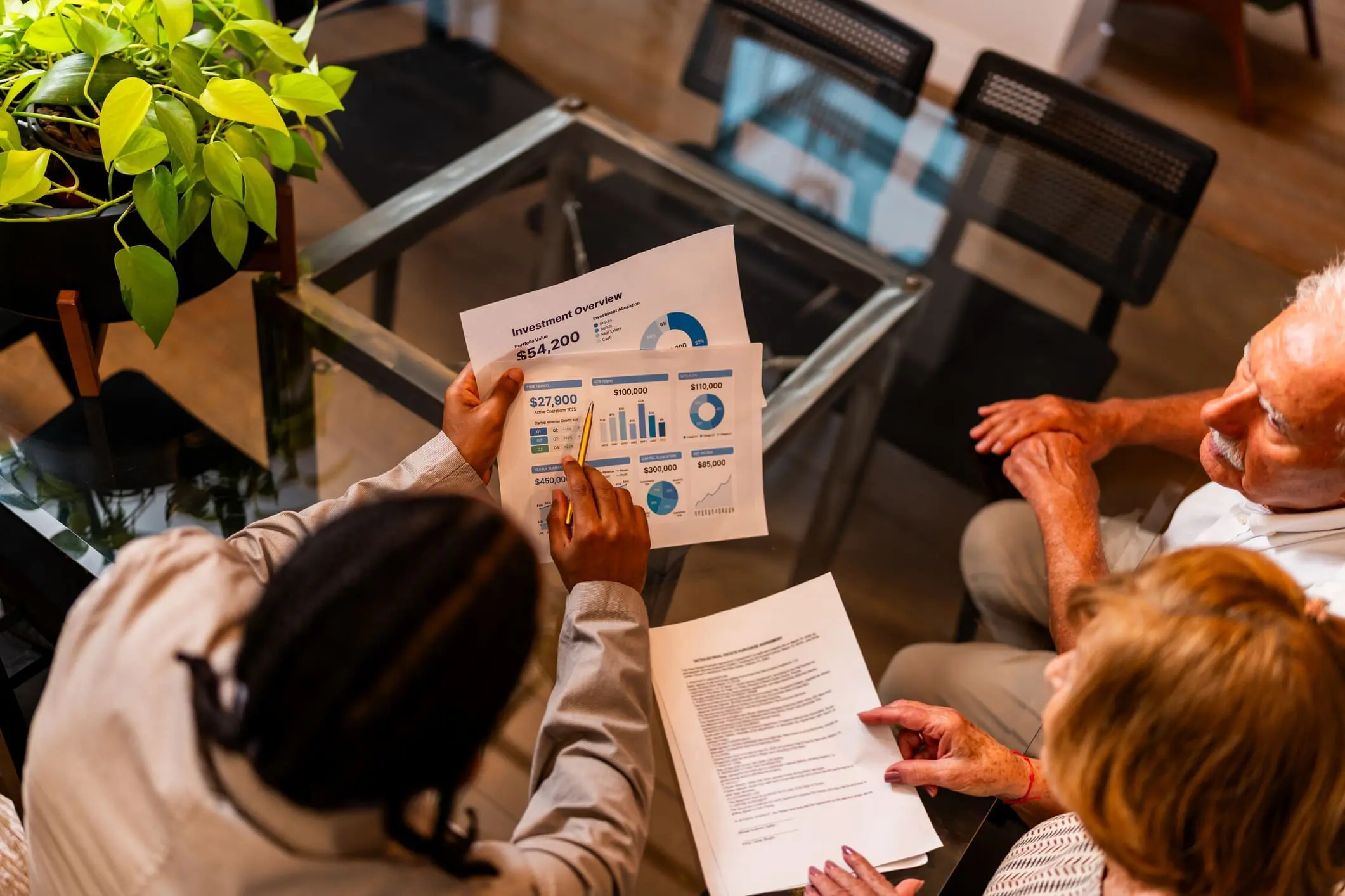 People reviewing financial documents at a table.