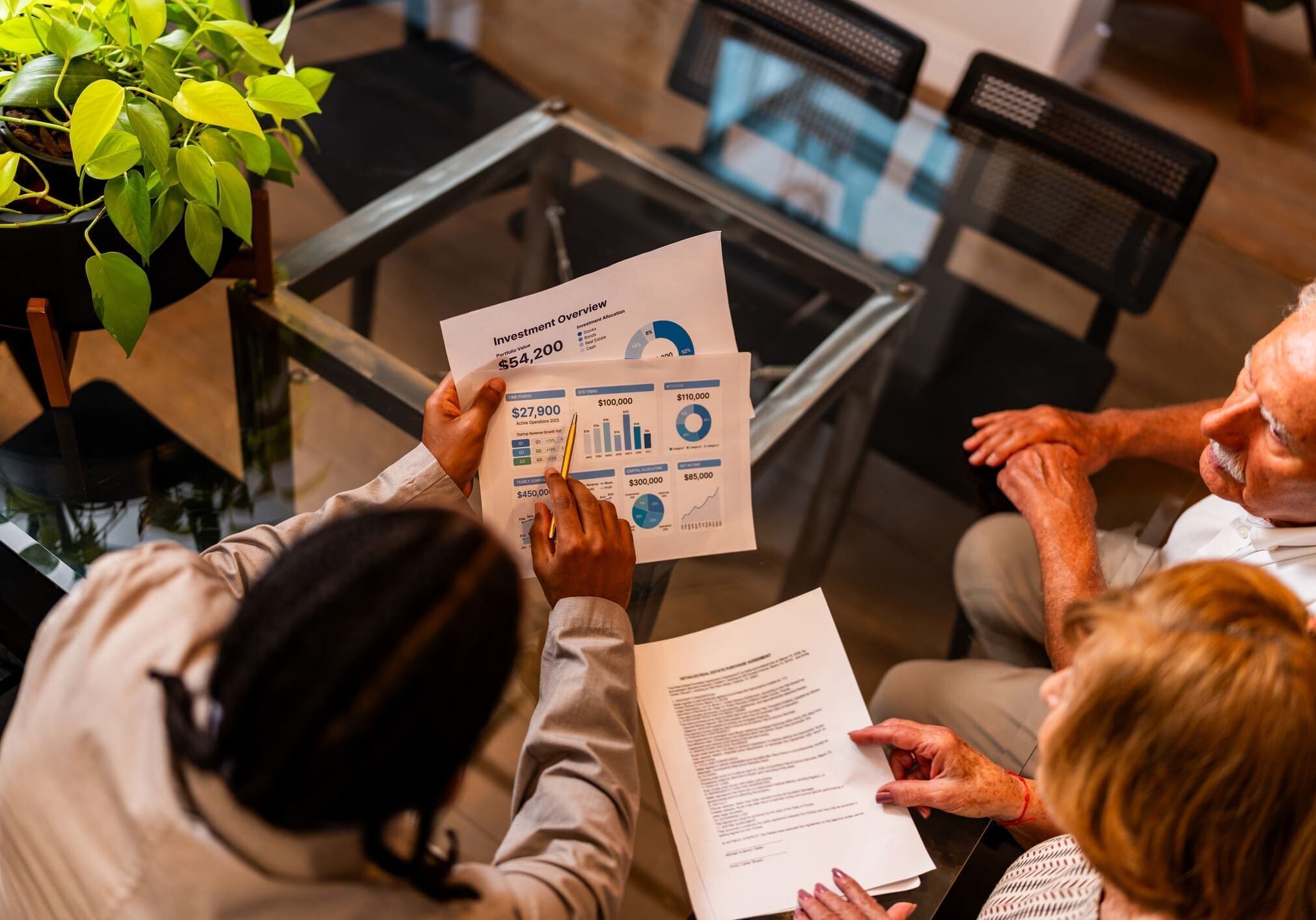 People reviewing financial documents at a table.